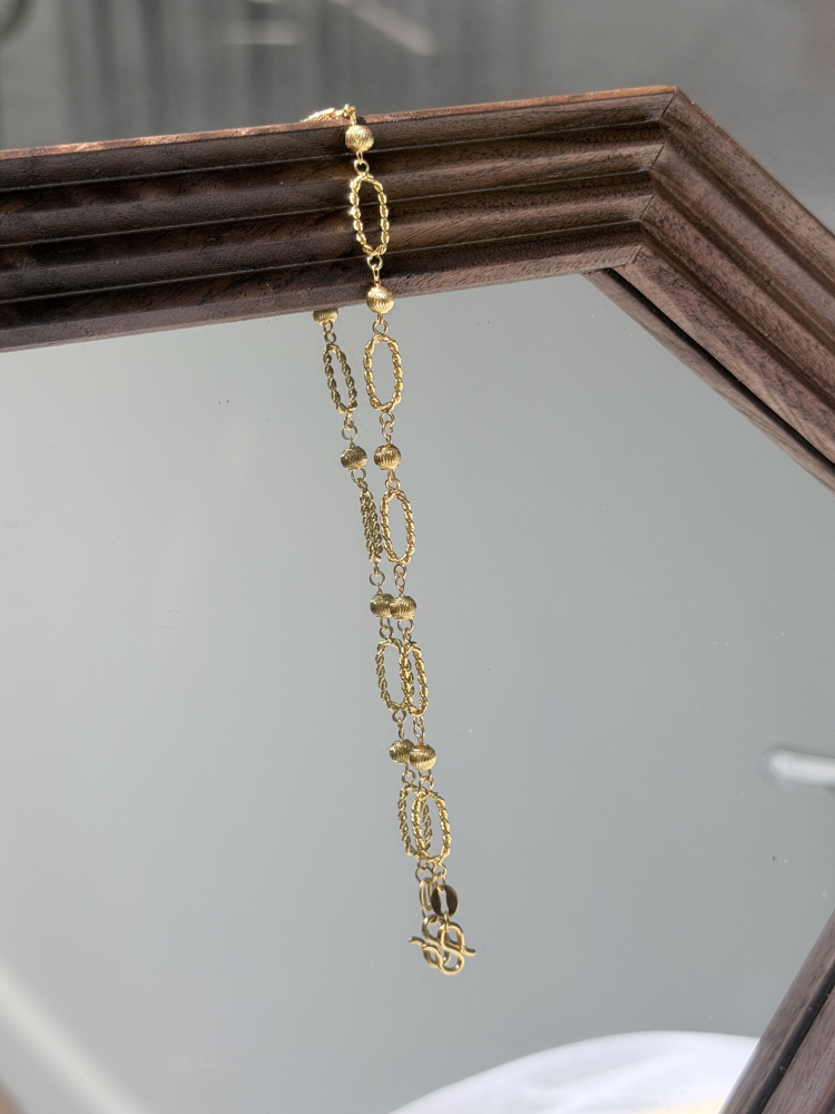 纏月｜5G麻花貓眼手鍊 — 純金9999 (worn photo)