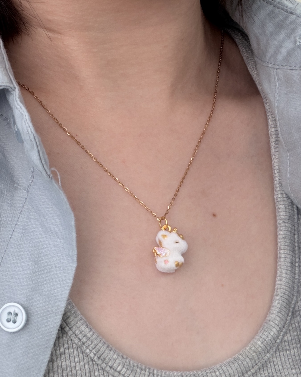 Fuzzy Unicorn Pendant — 24K Pure Gold (On model)